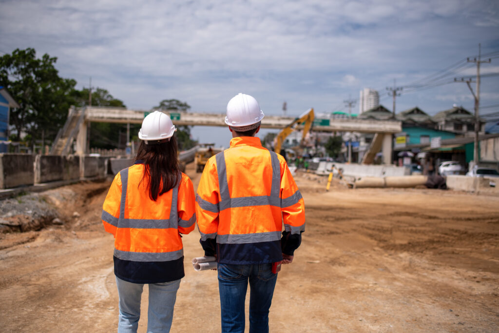 Construction workers inspecting an infrastructure project